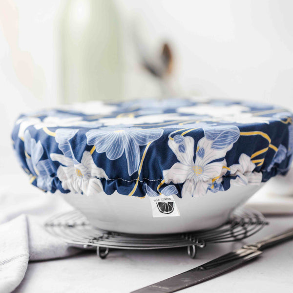 Floral-patterned bowl on a white surface with a blurred background
