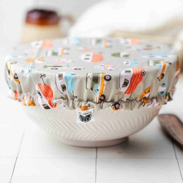 Fabric-covered bowl with camper pattern on a white surface
