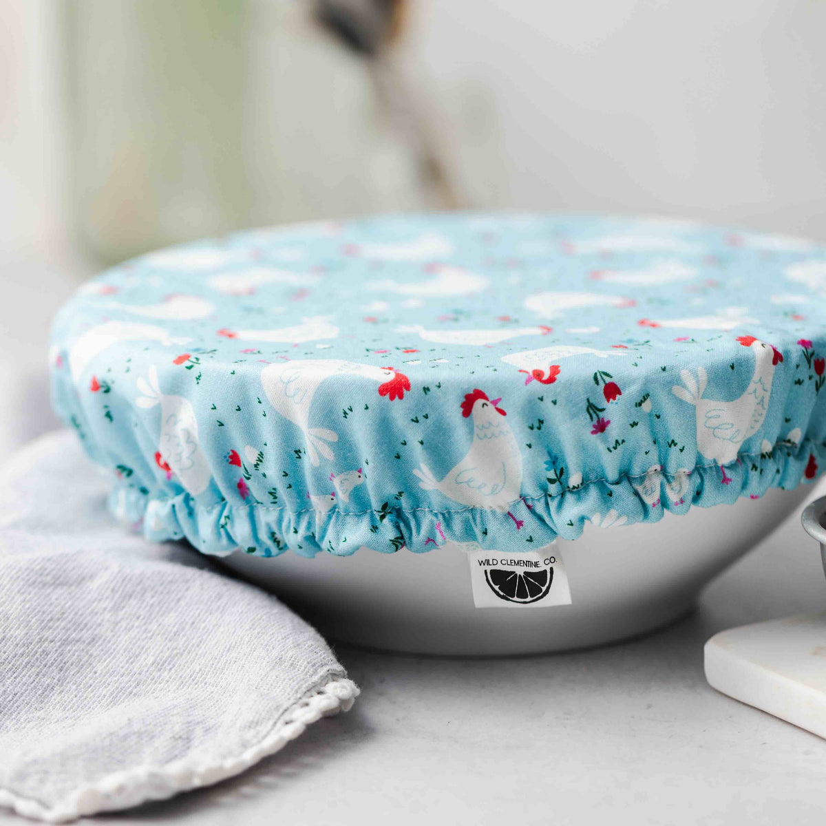Blue chicken-patterned cover on a bowl 