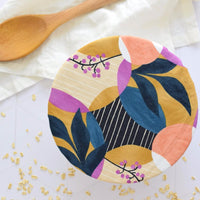 Reusable dish cover tropical moon glow pattern