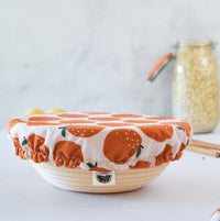 reusable dish cover in orange citrus