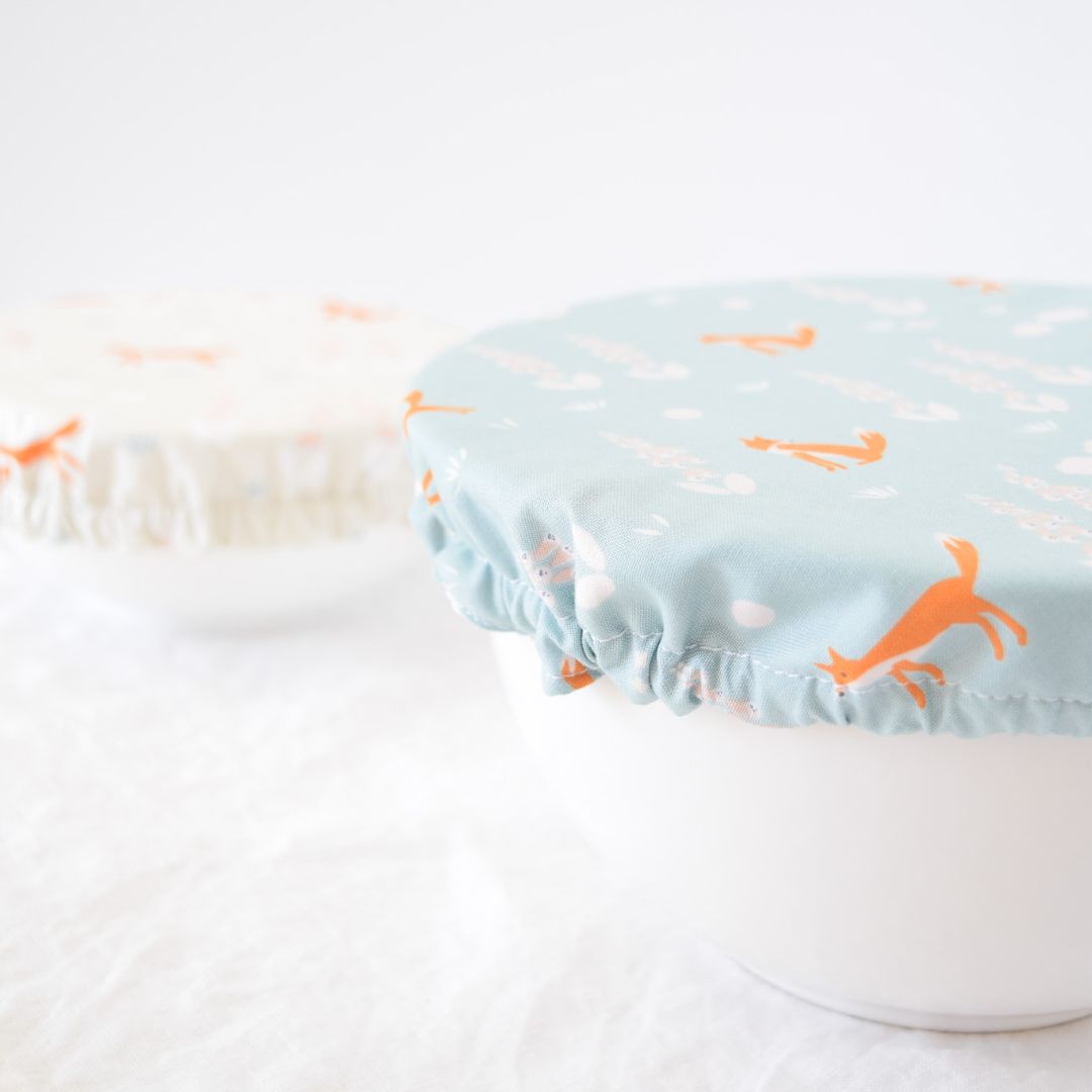 Reusable Dish Cover; aqua blue with orange foxes and delicate floral print; also featured in a cream variation