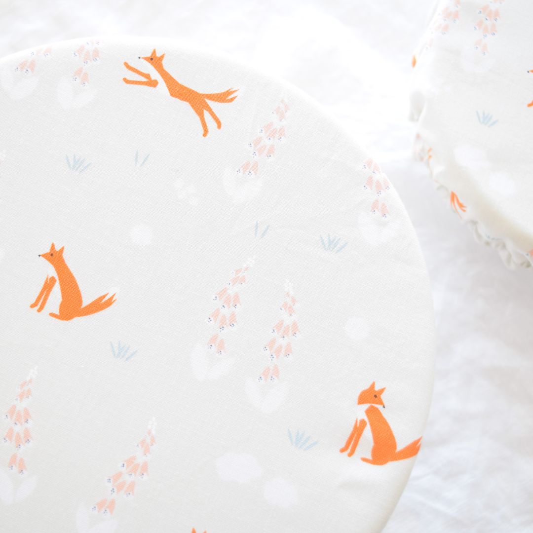 Reusable Dish Cover; cream with orange foxes and delicate floral print